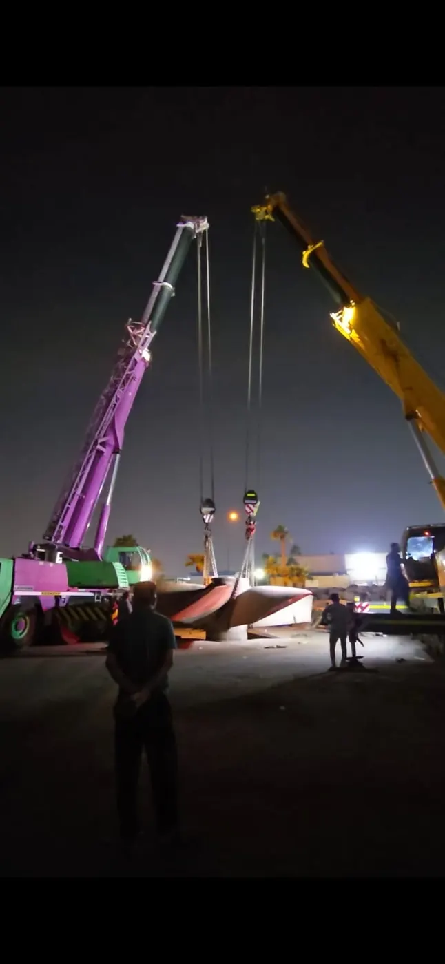 Crane lift during a night-time collection