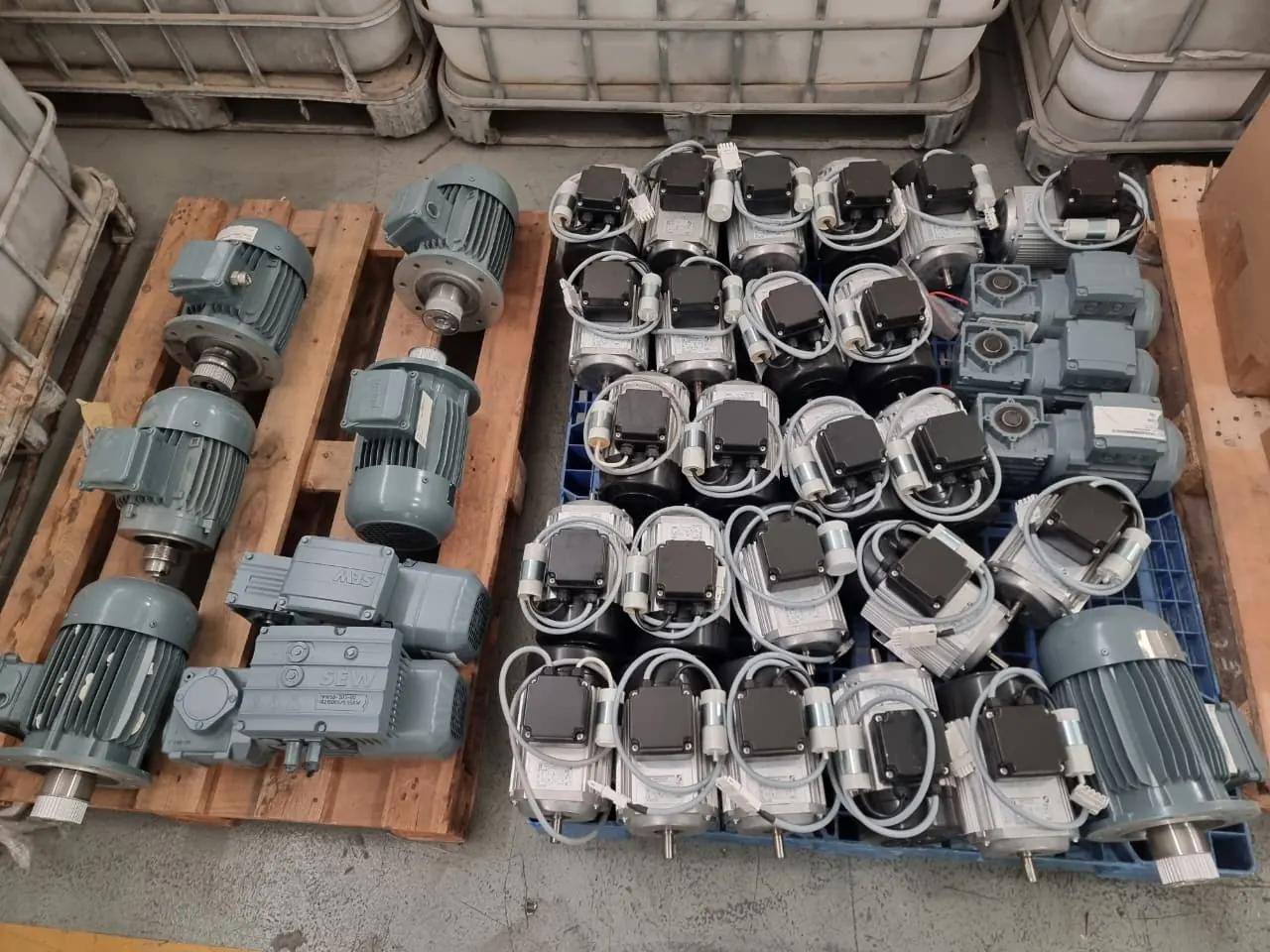 Pallets of surplus electric motors bought as a single lot