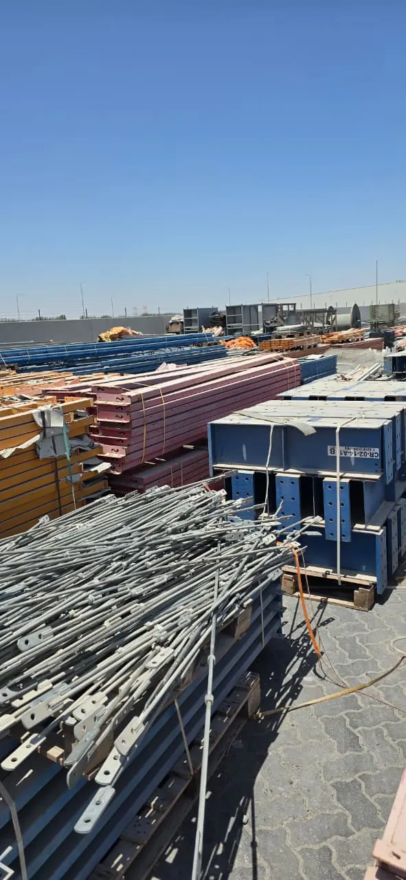 Stacked structural steel sections in a yard
